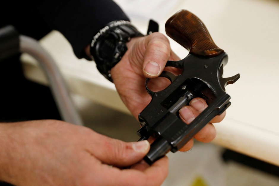 A handgun is checked in during a community gun buy-back program in White Plains, New York, April 13, 2018.