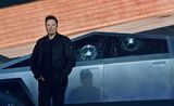 Elon Musk stands in front of the shattered windows of the newly unveiled Cybertruck in 2019.