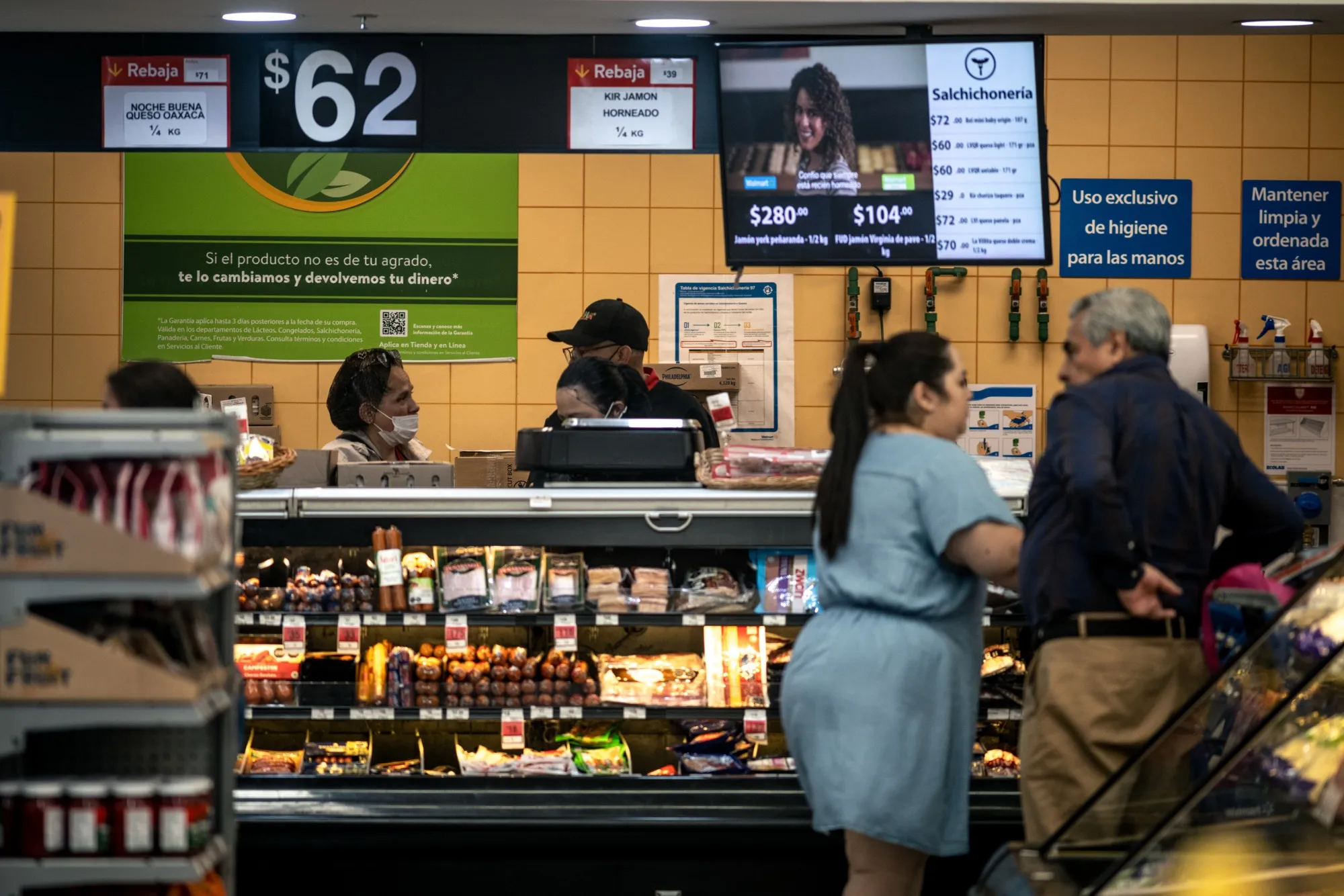 Shoppers browse products at a Wal-Mart de Mexico store in Mexico City, Mexico.