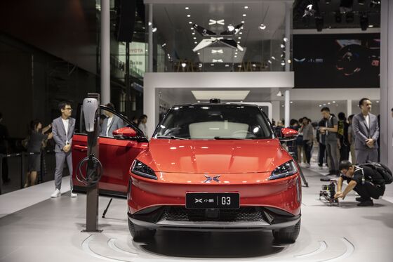 China Electric-Car Gold Rush Lures Hopefuls as Tesla Push Looms
