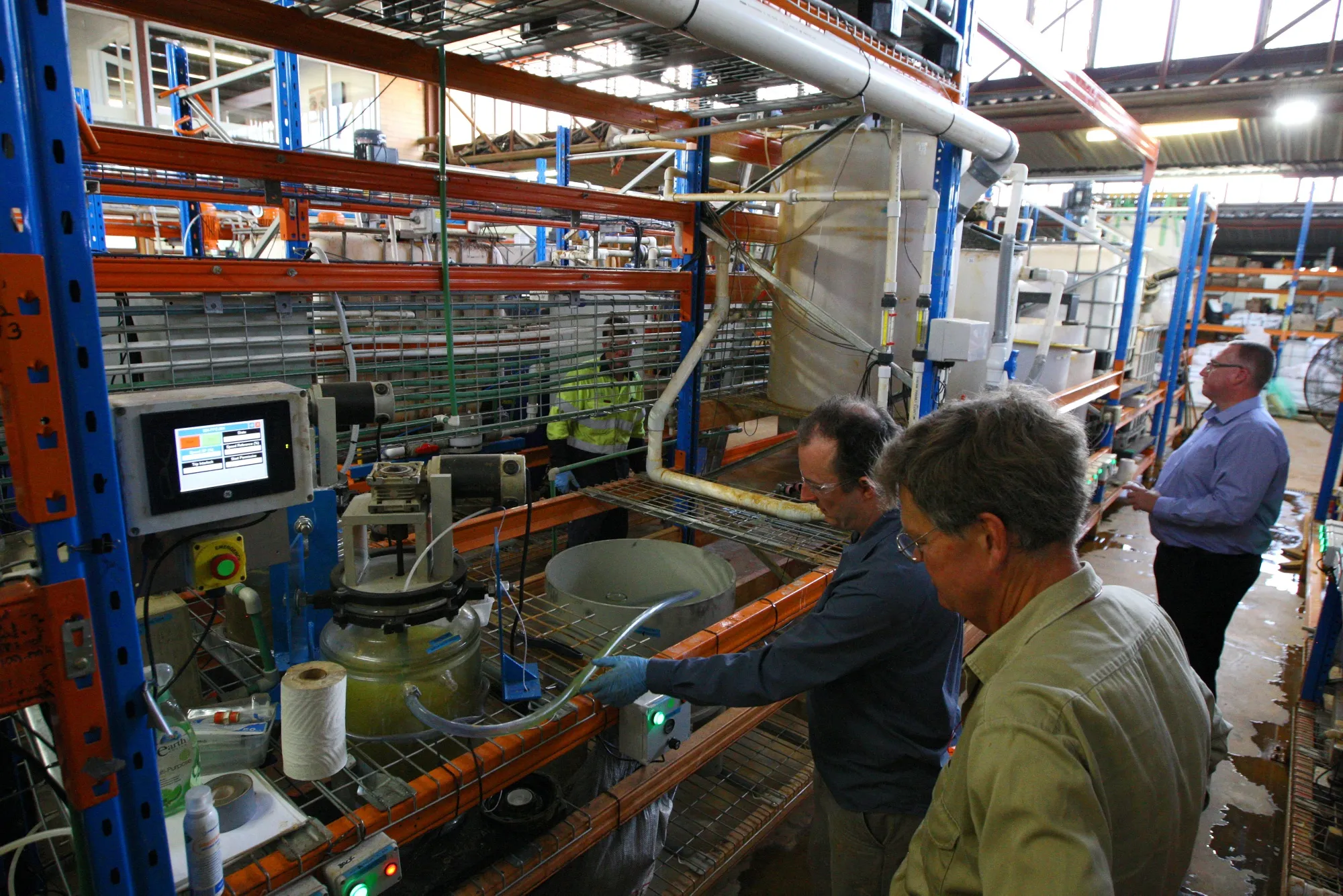 Technicians monitor a scandium solvent extraction process at an Australian Mines Ltd. test plant in Perth, Australia.