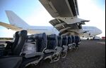 Aircraft seats sit under the wing of an airplane near Cirencester, U.K.