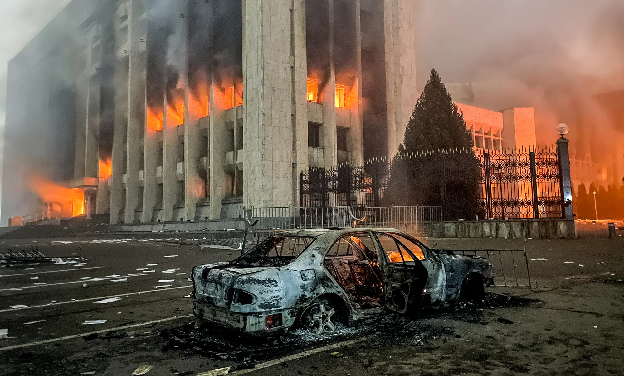A burnt car outside the mayors office on fire in Almaty on Jan. 5.&nbsp;