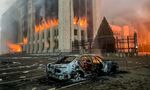 A burnt car outside the mayors office on fire in Almaty on Jan. 5.&nbsp;