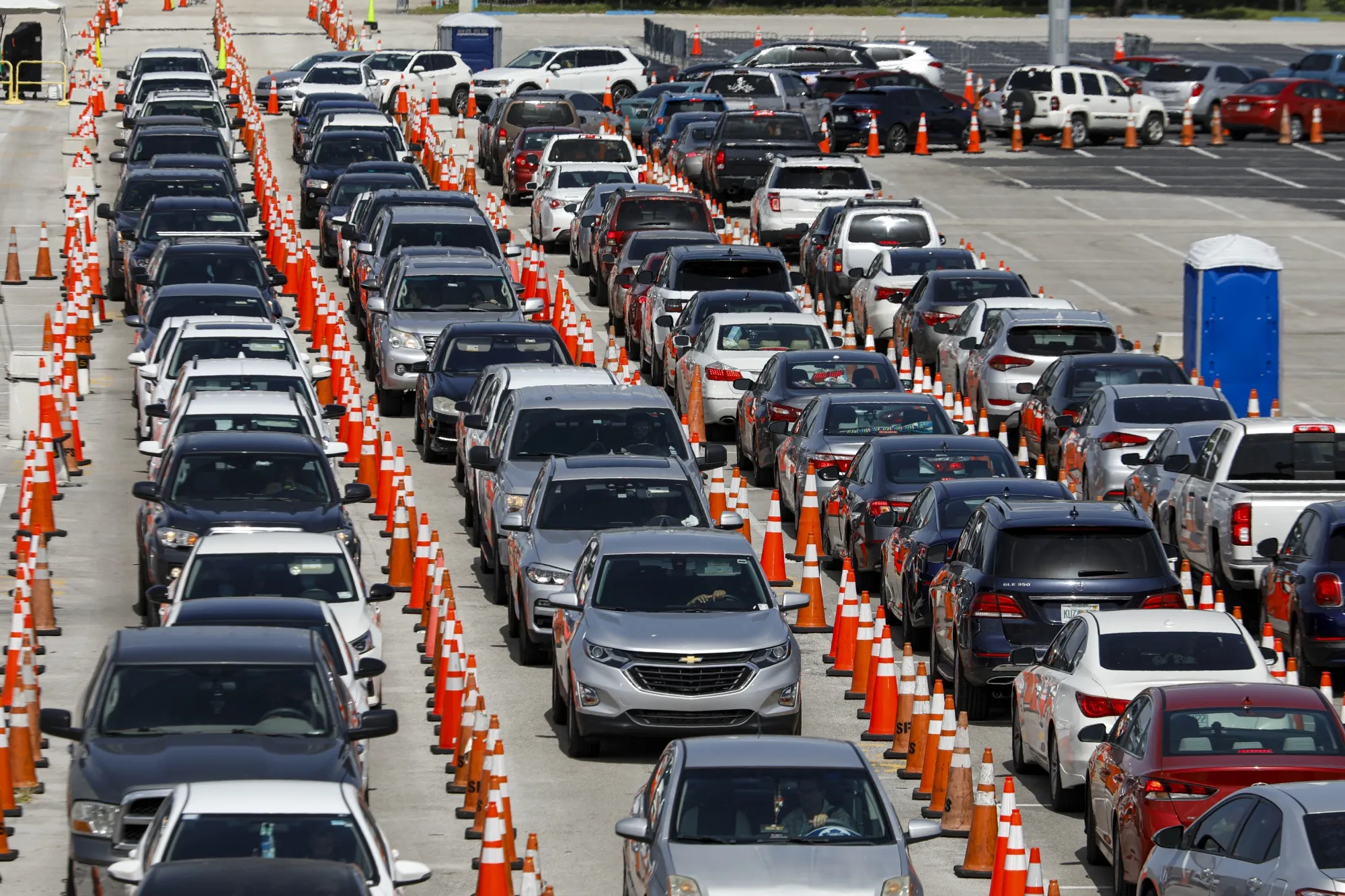 Vehicles in line to enter a Covid-19 drive-thru testing site at Hard Rock Stadium in Miami Gardens, Florida.