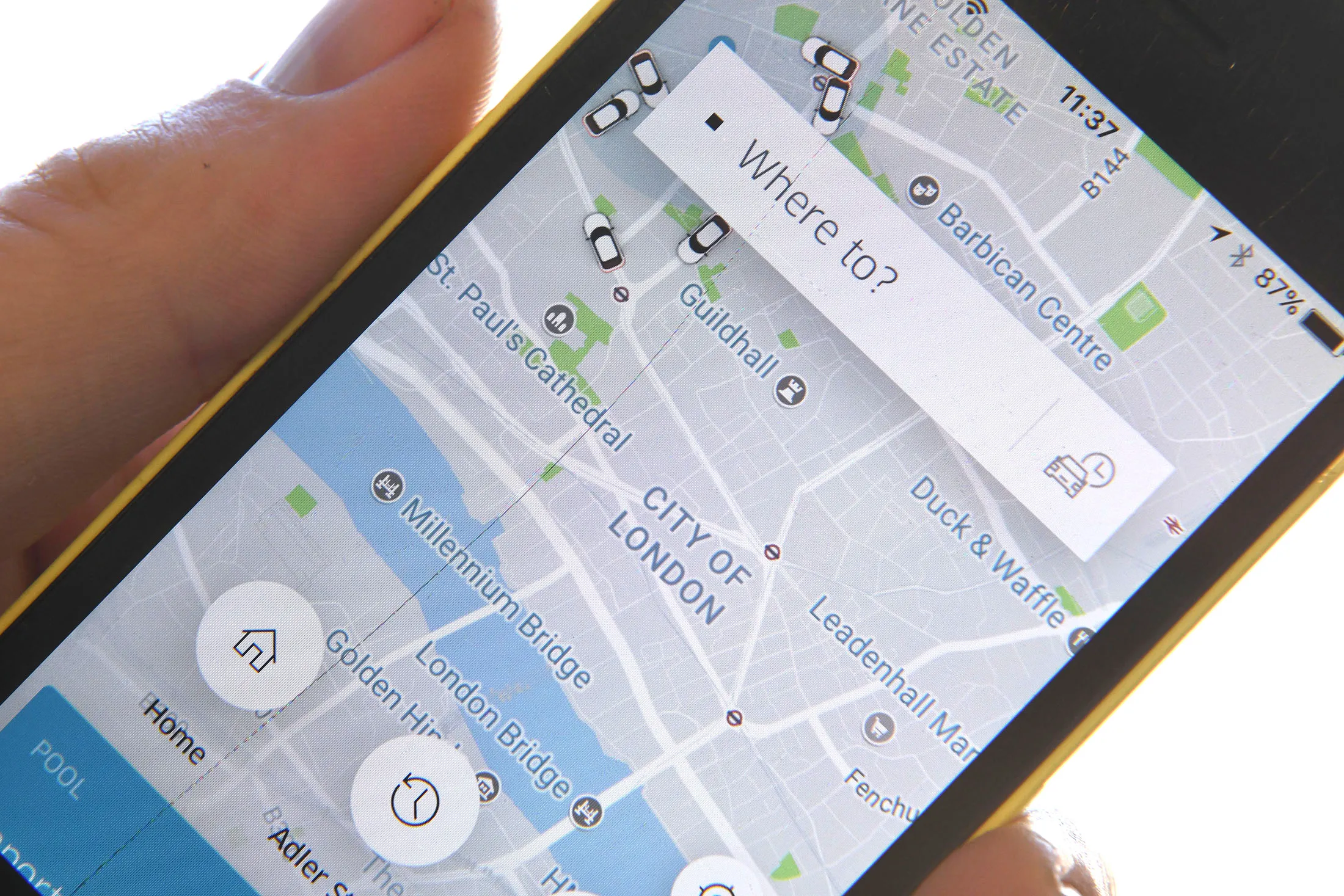 A man poses holding a smartphone showing the App for ride-sharing cab service Uber in London on September 22, 2017.London transport authorities announced Friday they would not renew Uber's licence to operate in the city when it expires on September 30 for safety reasons, although it has three weeks to appeal. / AFP PHOTO / Ben FATHERS        (Photo credit should read BEN FATHERS/AFP/Getty Images)
