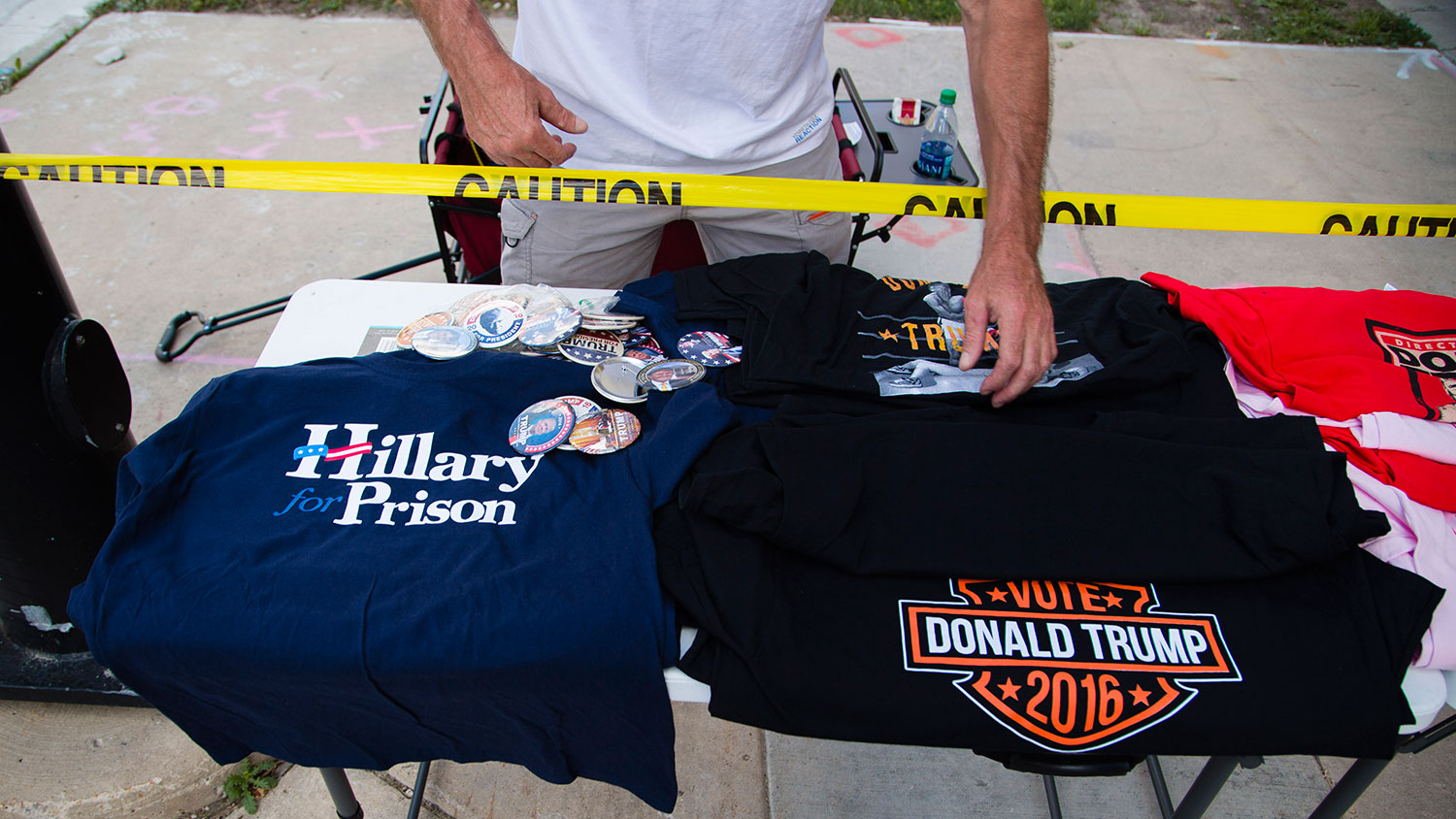 A vendor is seen selling pro-Donald Trump shirts and buttons outside a rally in Green Bay, Wisconsin, on Aug. 5, 2016.
