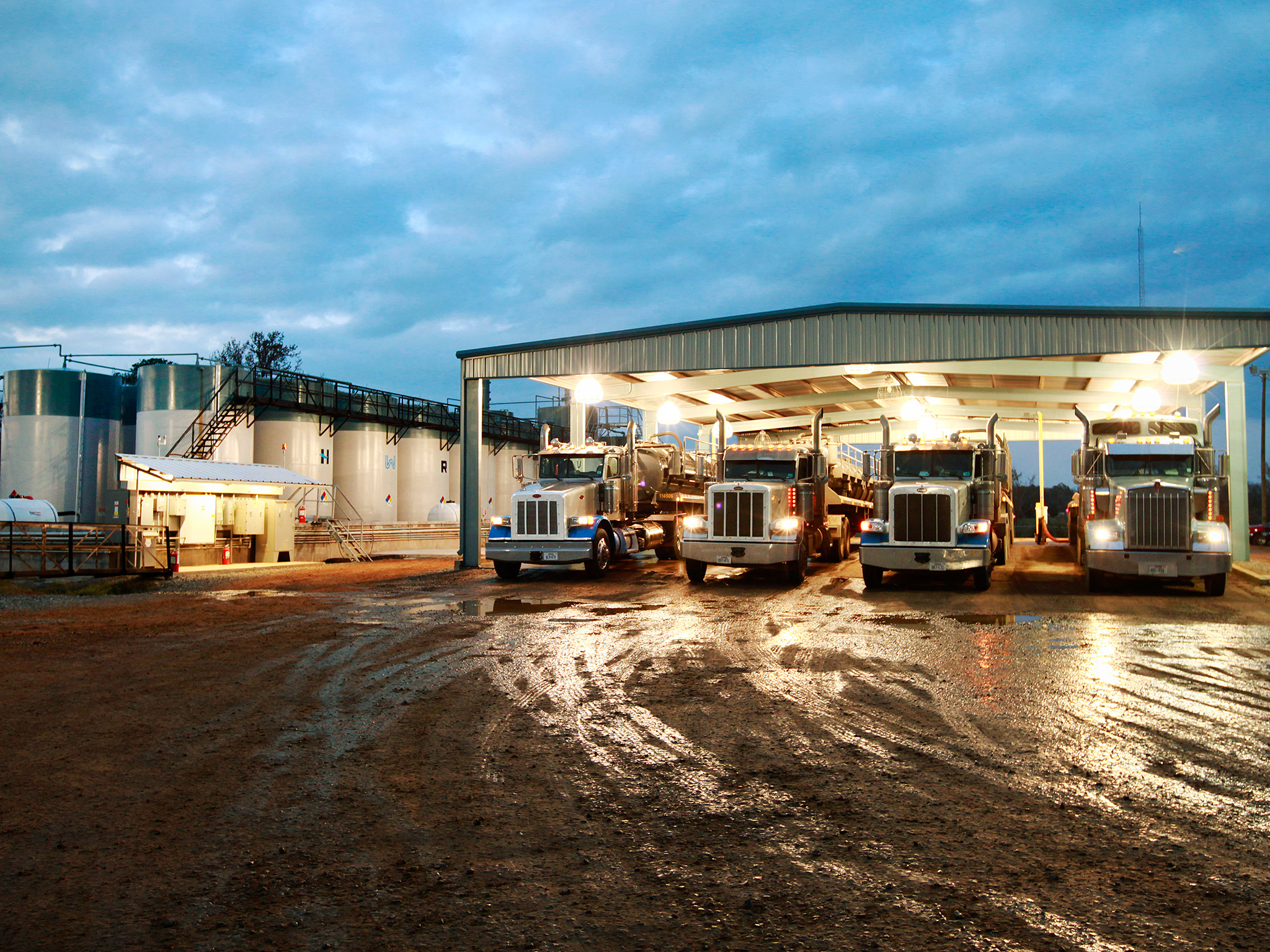 Transport trucks are parked at a Heckmann Water Resources (HWR) treatment plant that separates oil, sediment and water mixed during the hydraulic fracturing process, near Shreveport, Louisiana.

