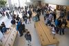 Customers view merchandise displayed during the sales launch of the Apple Inc. iPhone 8 smartphone, Apple watch series 3 device, and Apple TV 4K inside a store in San Francisco, California, U.S., on Friday, Sept. 22, 2017.