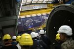 BERLIN, GERMANY - AUGUST 28: Employees stand next to a gas turbine at the Siemens Energy plant, part of German industrial conglomerate Siemens on August 28, 2024 in Berlin, Germany. This is Starmer's first official visit to Germany since he became prime minister. (Photo by Justin Tallis - WPA Pool/Getty Images)