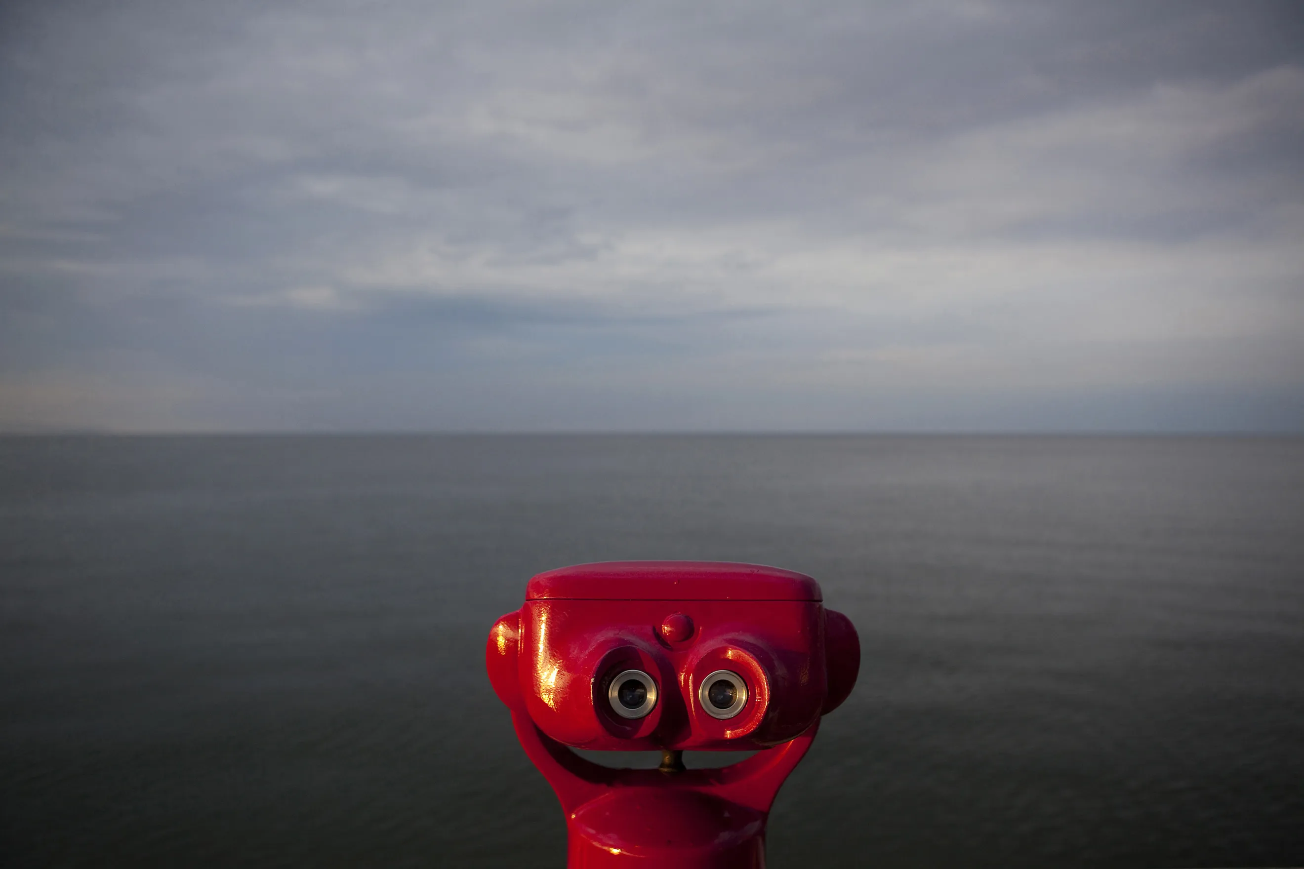 Coin operated binoculars look out over the Baltic Sea
