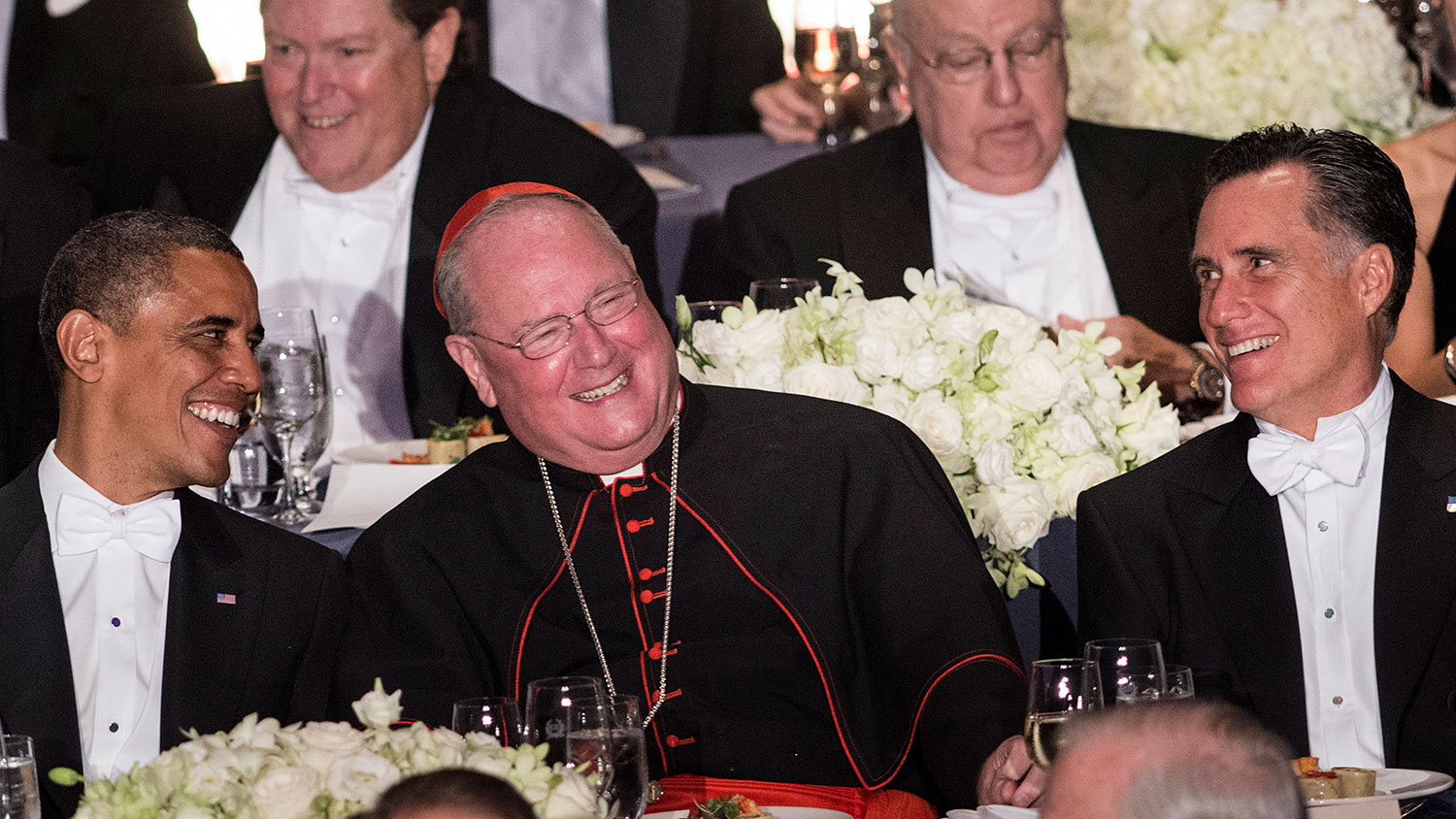 President Barack Obama, Cardinal Timothy Dolan, and Republican presidential candidate Mitt Romney attend the 67th annual Al Smith dinner at the Waldorf Astoria hotel Oct. 18, 2012, in New York, New York.
