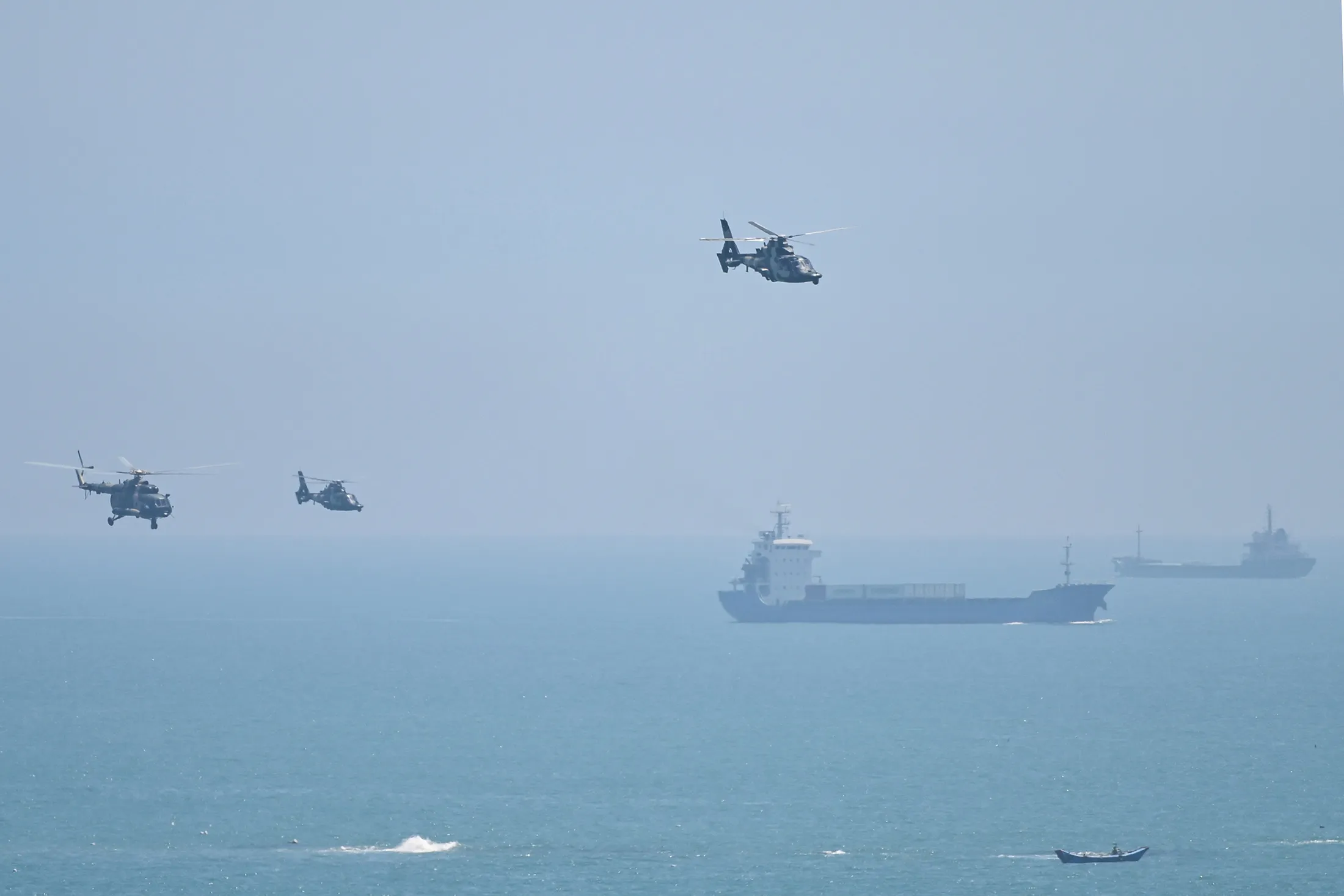 Chinese military helicopters fly past Pingtan island, one of mainland China's closest point from Taiwan, in Fujian province on Aug.&nbsp;4.