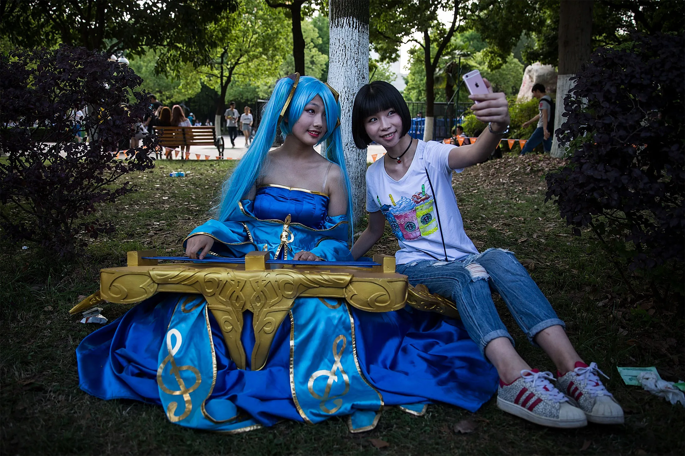 A webcasting hostess poses take pictures with a fan during the Douyu festival on May 29, 2017 in Wuhan China.&nbsp;