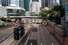 Vehicles travel along Queensway in Hong Kong, China.