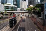 Vehicles travel along Queensway in Hong Kong, China.