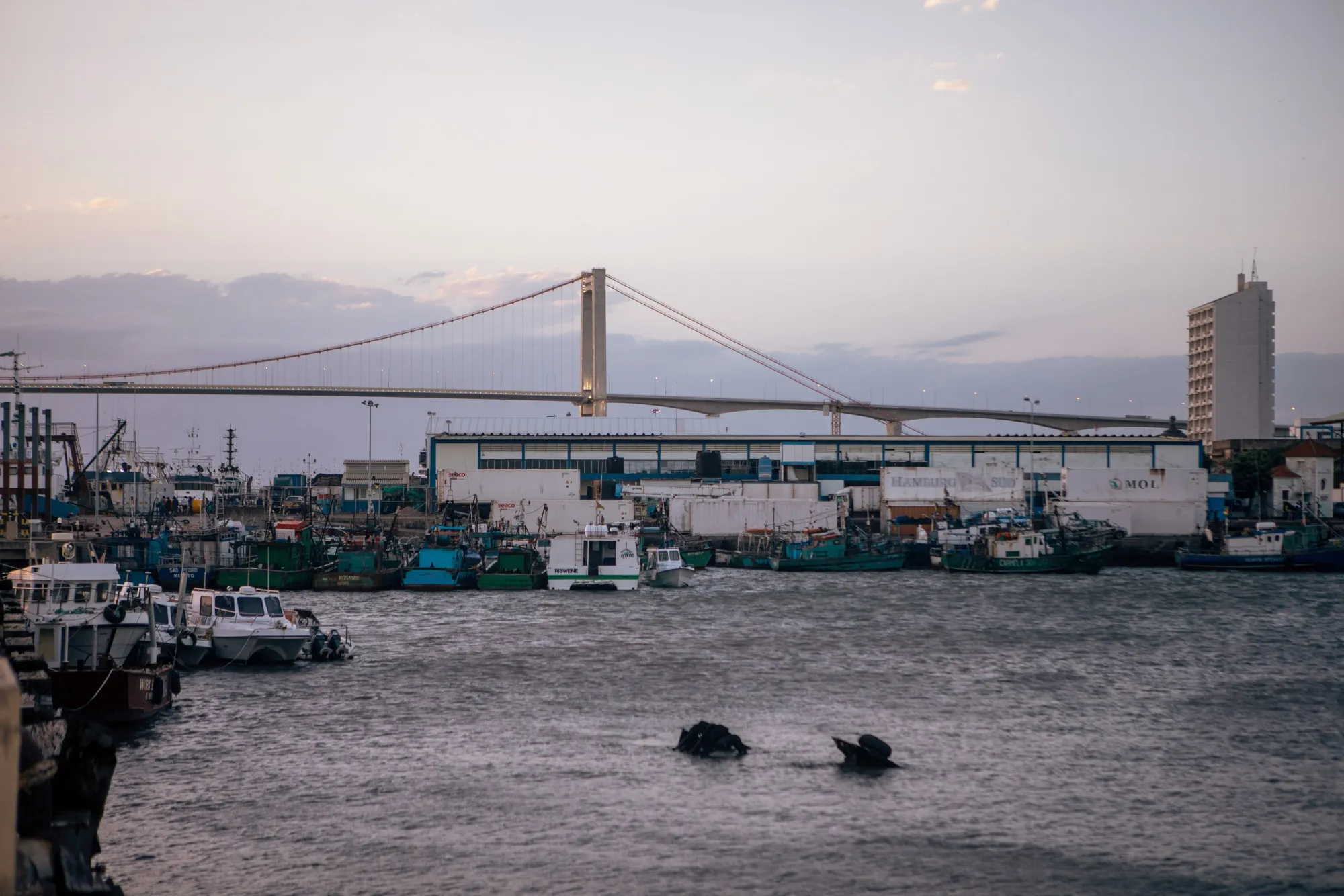 The Katembe bridge near the city port at dusk in Maputo, Mozambique.