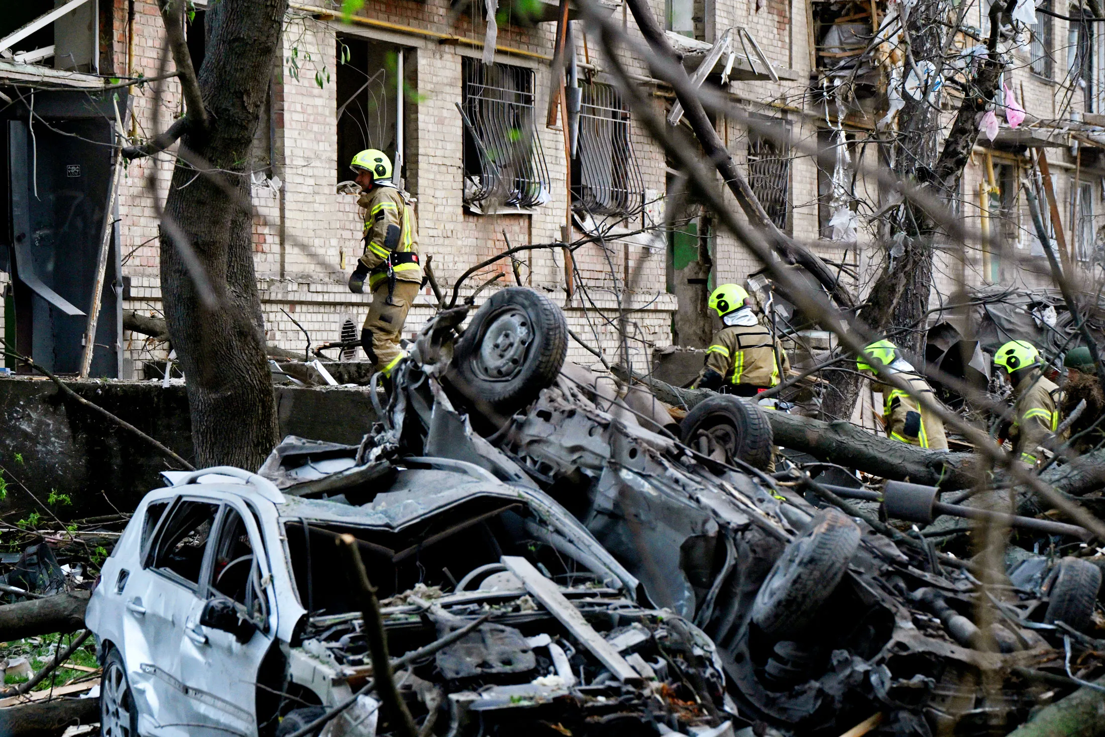 Rescue workers attend&nbsp;the site of a Russian missile attack in Kyiv on April 24.