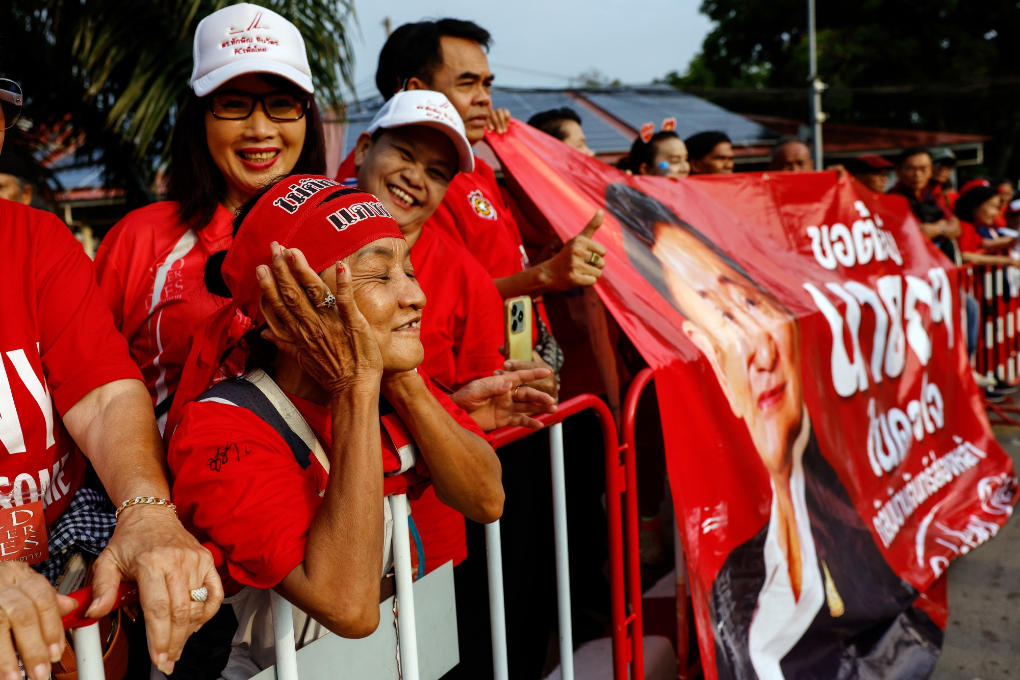 Supporters of Thailand's former prime minister Thaksin Shinawatra await his release from Klong Prem Central Prison in Bangkok, Thailand, on Monday, May 11, 2026. Thaksin walked out of a Bangkok prison to the cheers of loyal supporters on Monday, returning to a political landscape transformed by the decisive victory of the rival conservative Bhumjaithai Party in February elections. Photographer: Dario Pignatelli/Bloomberg