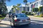 A car with a New York license plate parked Outside Palm Beach Day Academy on Seaview Street in Palm Beach.