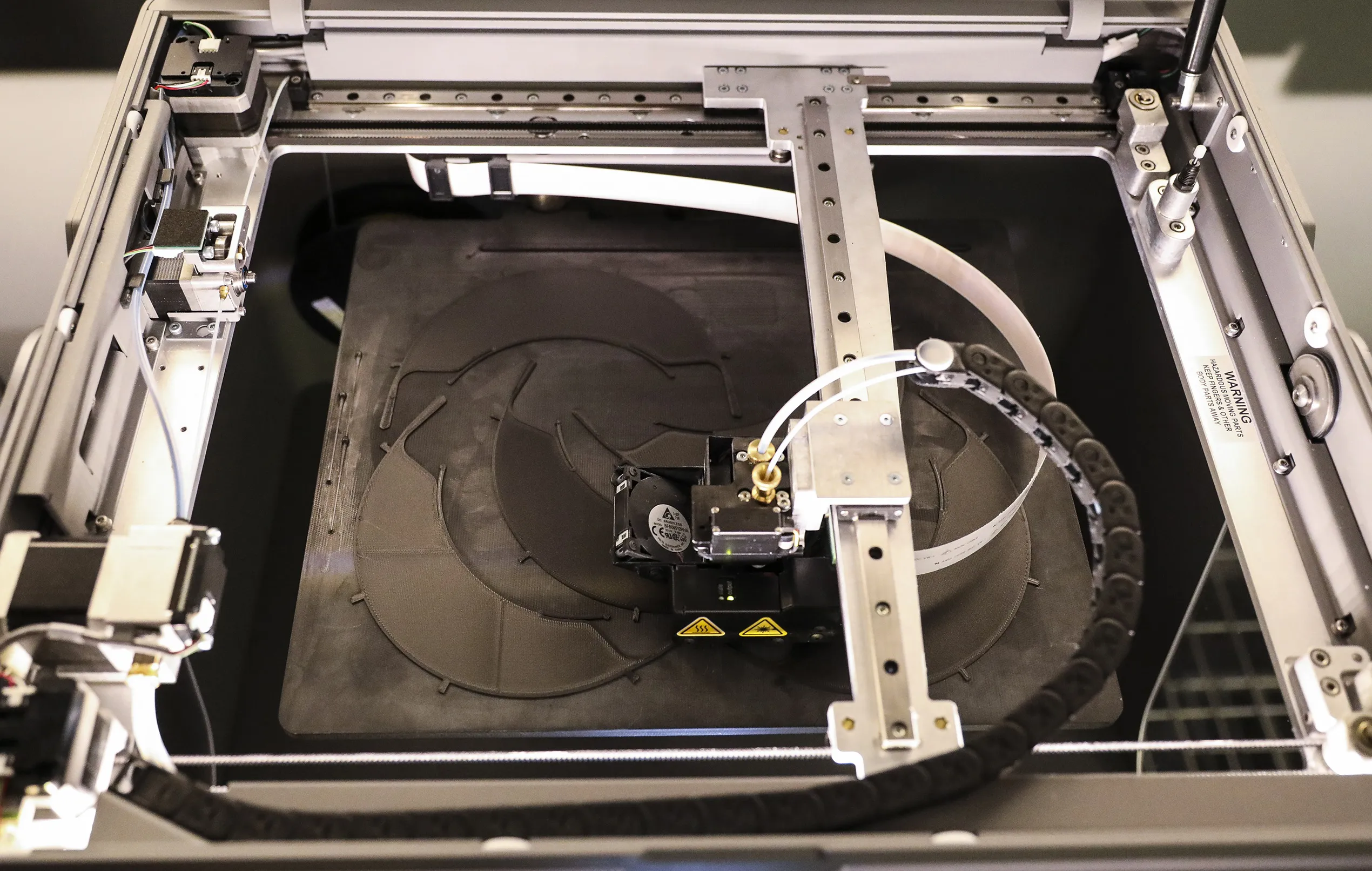 A Markforged 3D printer creates a face shield.