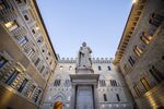 The statue of Sallustio Bandini, an economist and politician, stands in front of the Monte dei Paschi di Siena SpA bank headquarters in Siena.