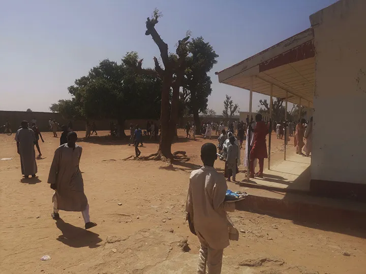People gather at the Government Science Secondary School in Kankara, Nigeria, on Dec. 12.
