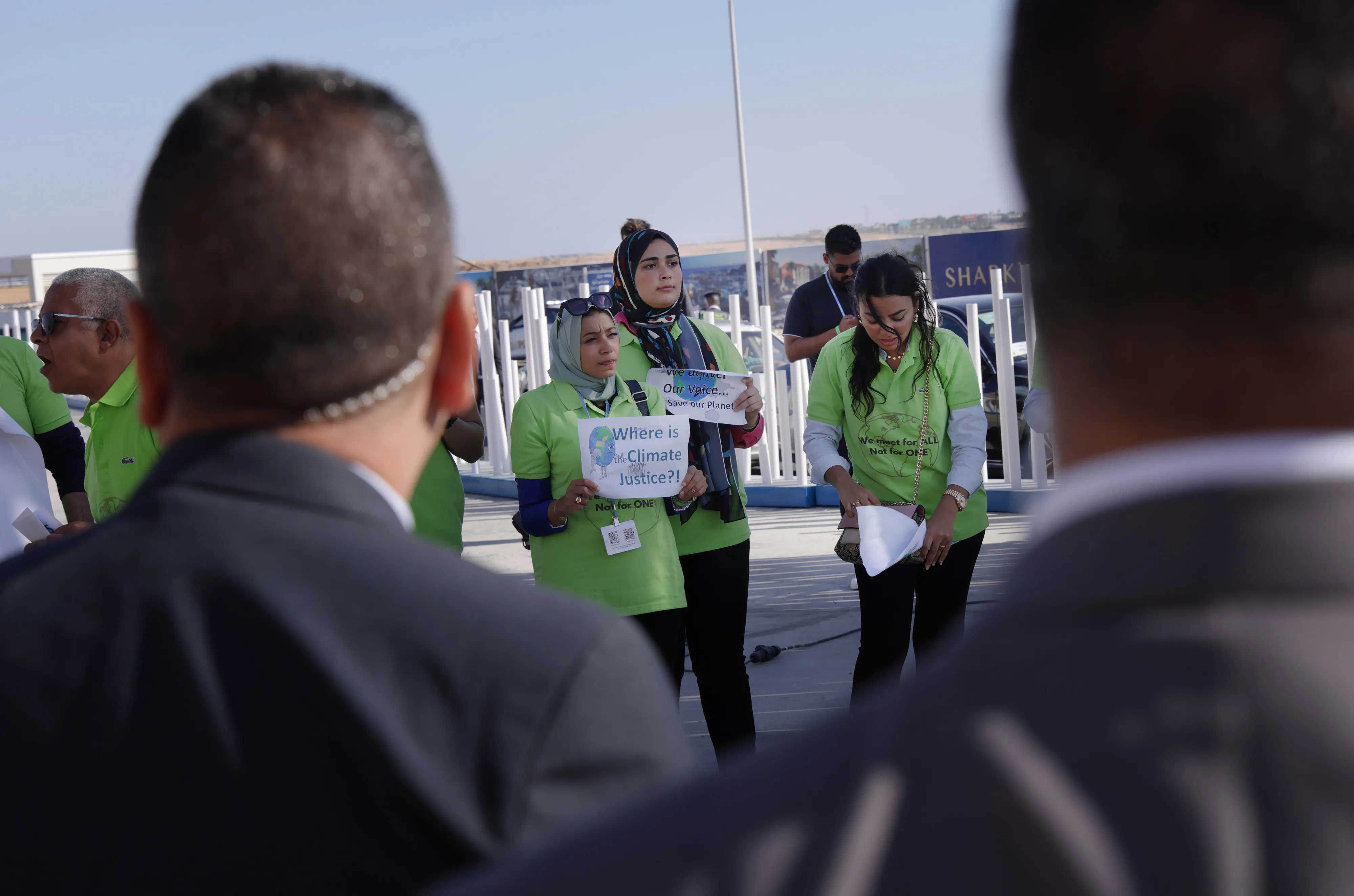 Egyptian security forces watch&nbsp;a small group of protesters outside the COP27 venue on Nov. 10.