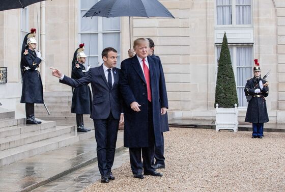 As Trump Is Grounded by Rain, Macron, Merkel Hail European Unity