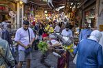 A street vendor sells fresh lemonade to tourists at the Emin Bazar in Istanbul, Turkey.