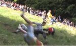 relates to American Hero Beats the British at Their Own Cheese-Rolling Game