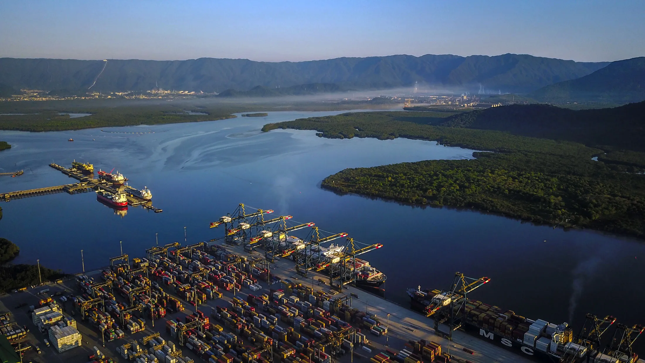 In this aerial photograph, rows of stacked shipping containers are seen&nbsp;at the Santos port in Sao Paulo.