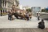 People take photographs with the Bund Bull statue in Shanghai, China, on Wednesday, Oct. 24, 2018. Chinese stocks pared an earlier surge, continuing a pattern of wild swings for the equity benchmark.