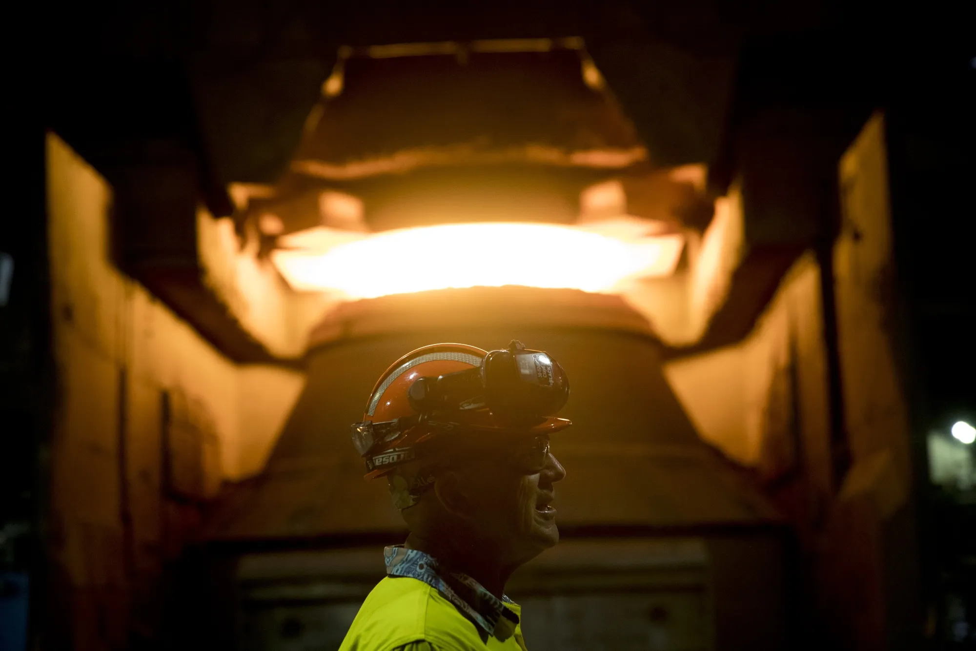 An employee in front of a steel furnace at BlueScope Steel Ltd. Port Kembla steelworks in Australia.&nbsp;