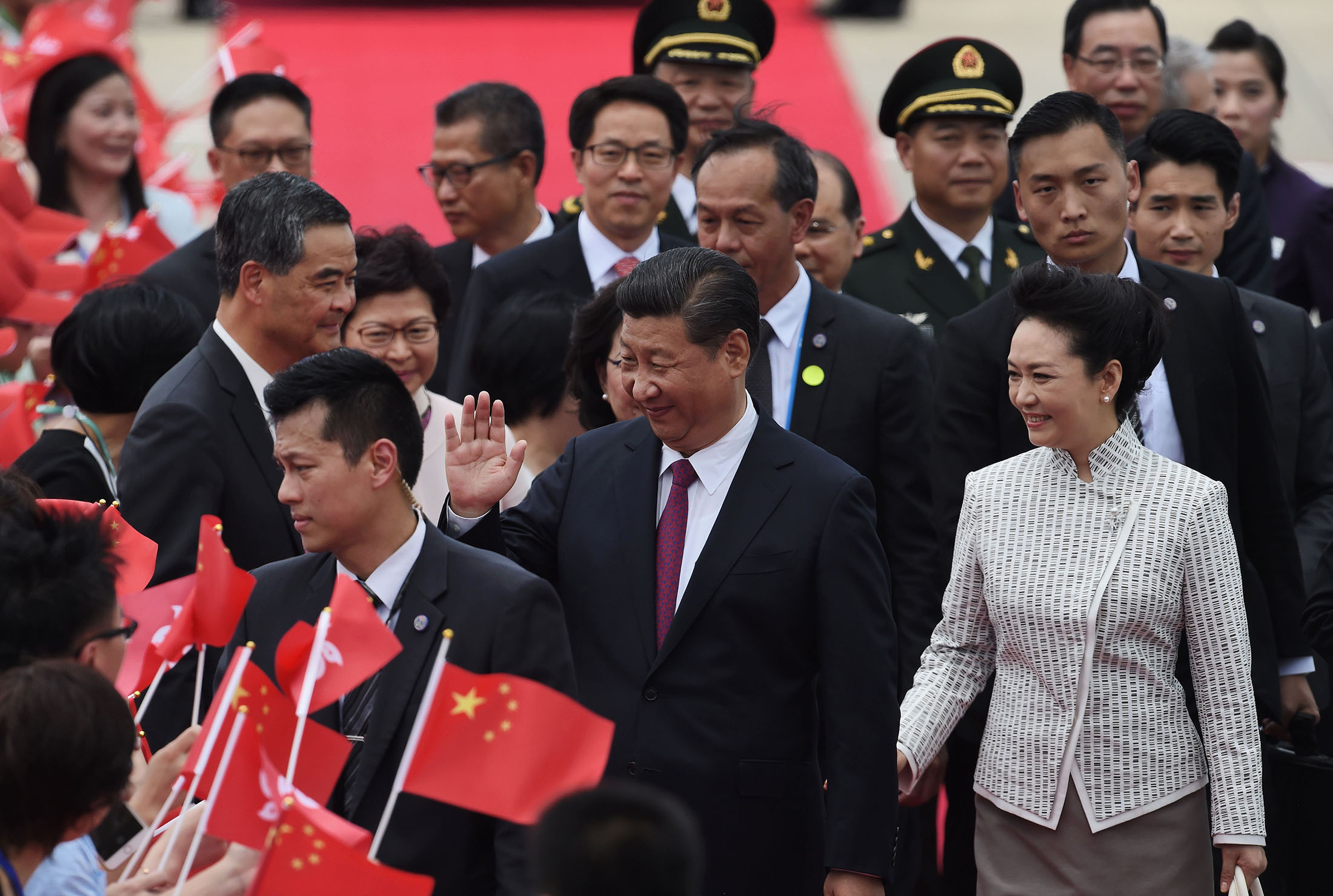 China's President Xi Jinping and his wife Peng Liyuan arrive in Hong Kong on June 29.
