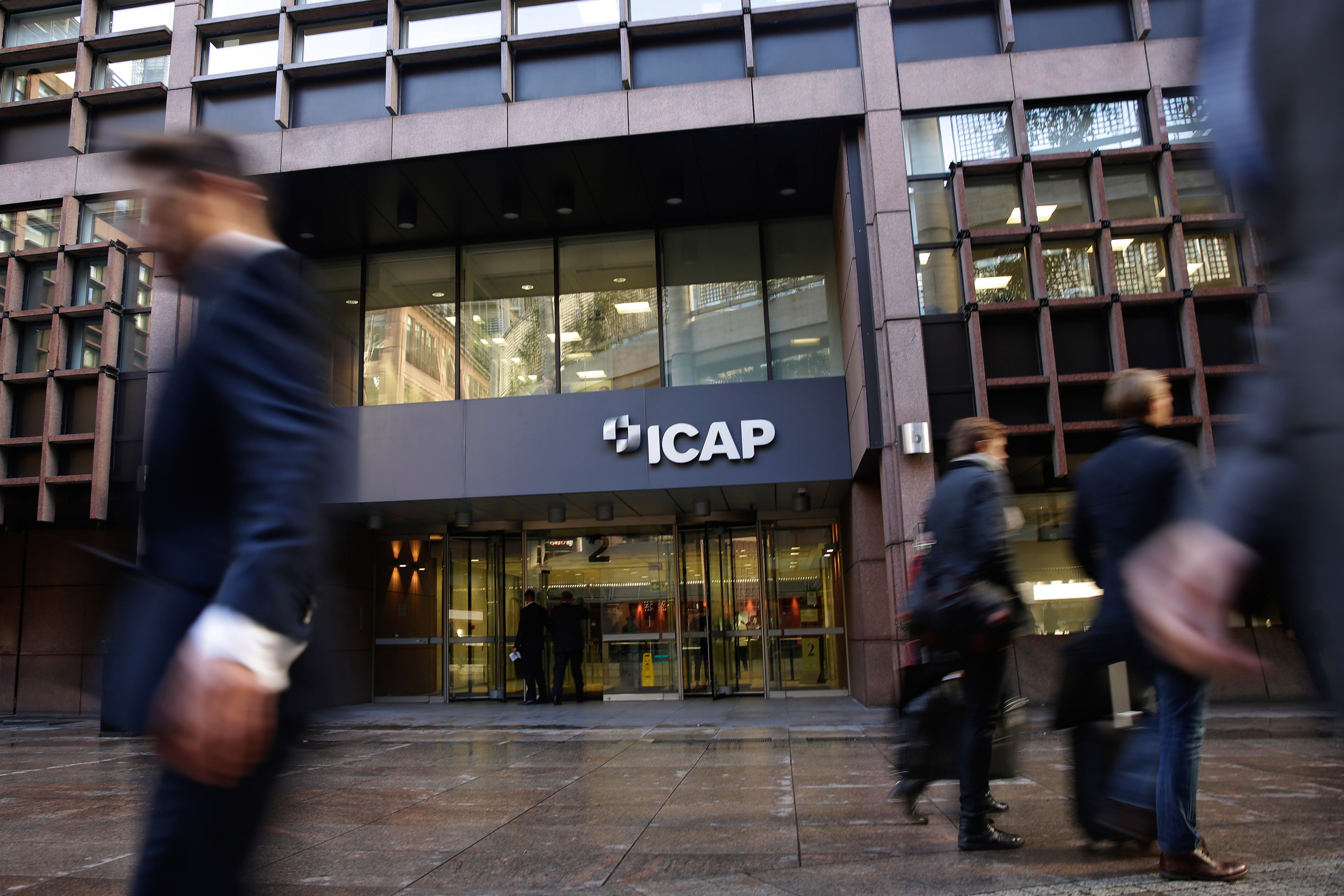 A sign hangs on the offices of ICAP Plc in London.