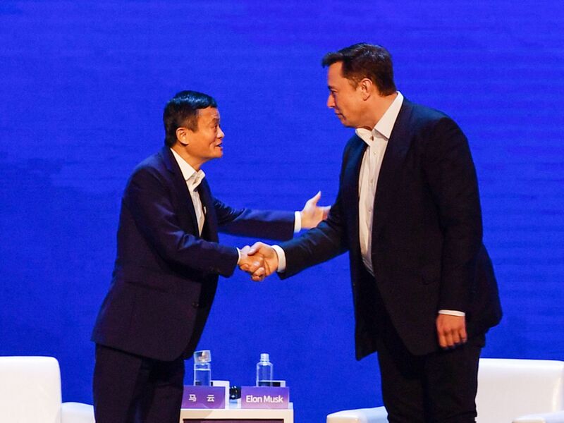 Elon Musk,Â CEO of Tesla, shakes hands withÂ Jack Ma during the World Artificial Intelligence ConferenceÂ in Shanghai on August 29, 2019.Â 