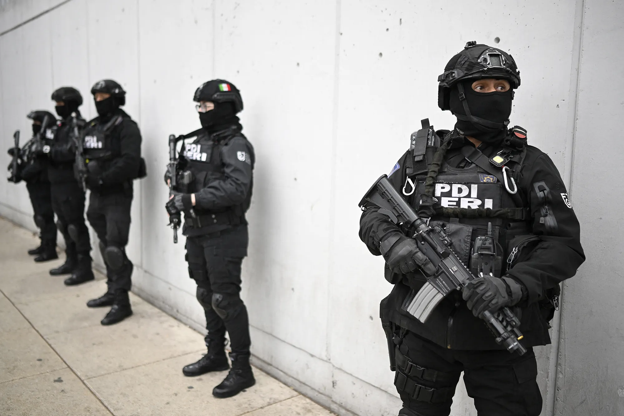 Members of the Investigative Police&nbsp;stand guard around the Specialized Prosecutor's Office for Organized Crime headquarters in Mexico City on Feb. 22.
