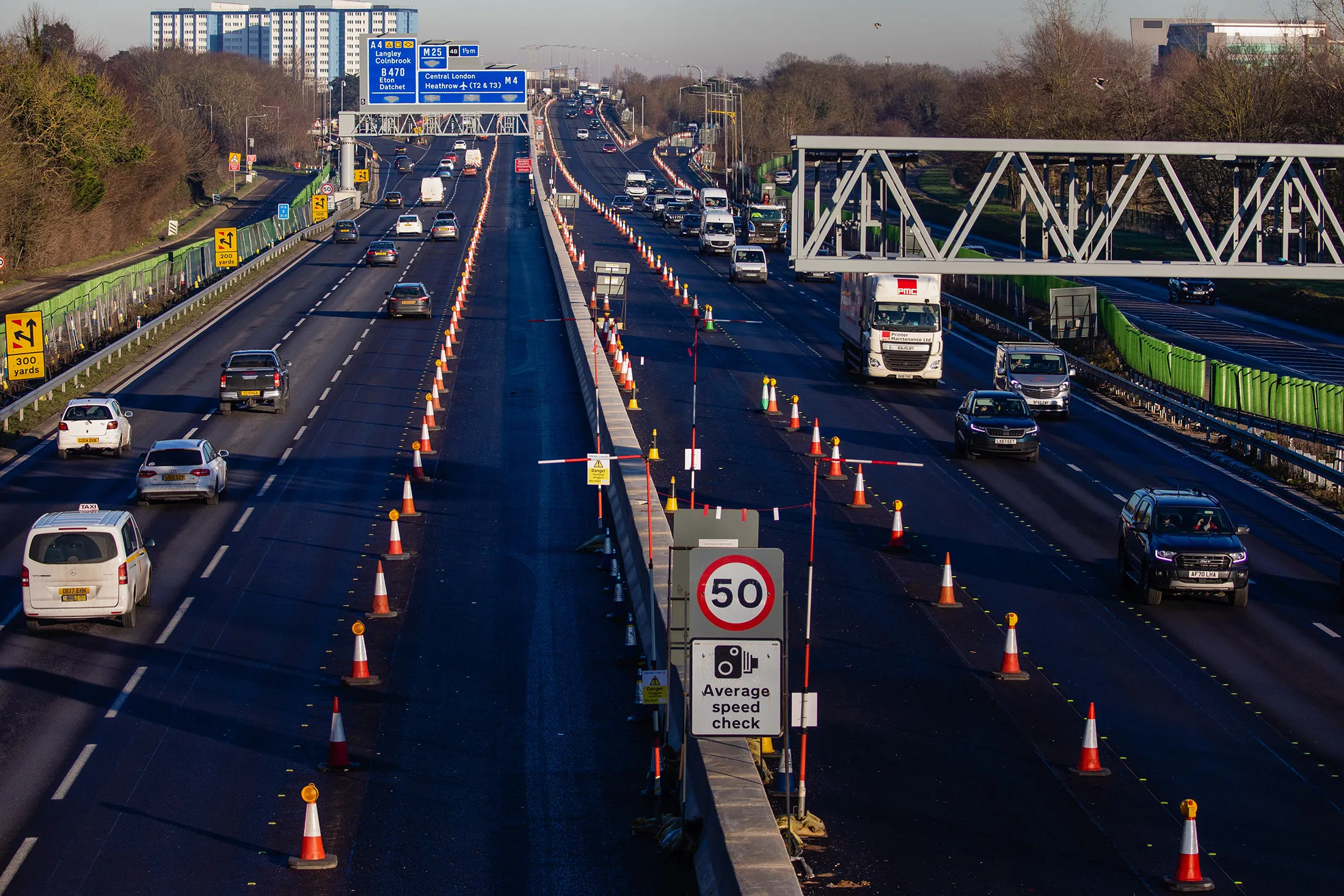 Traffic passes along a section of the M4 which is being converted to a smart motorway in Langley, UK.