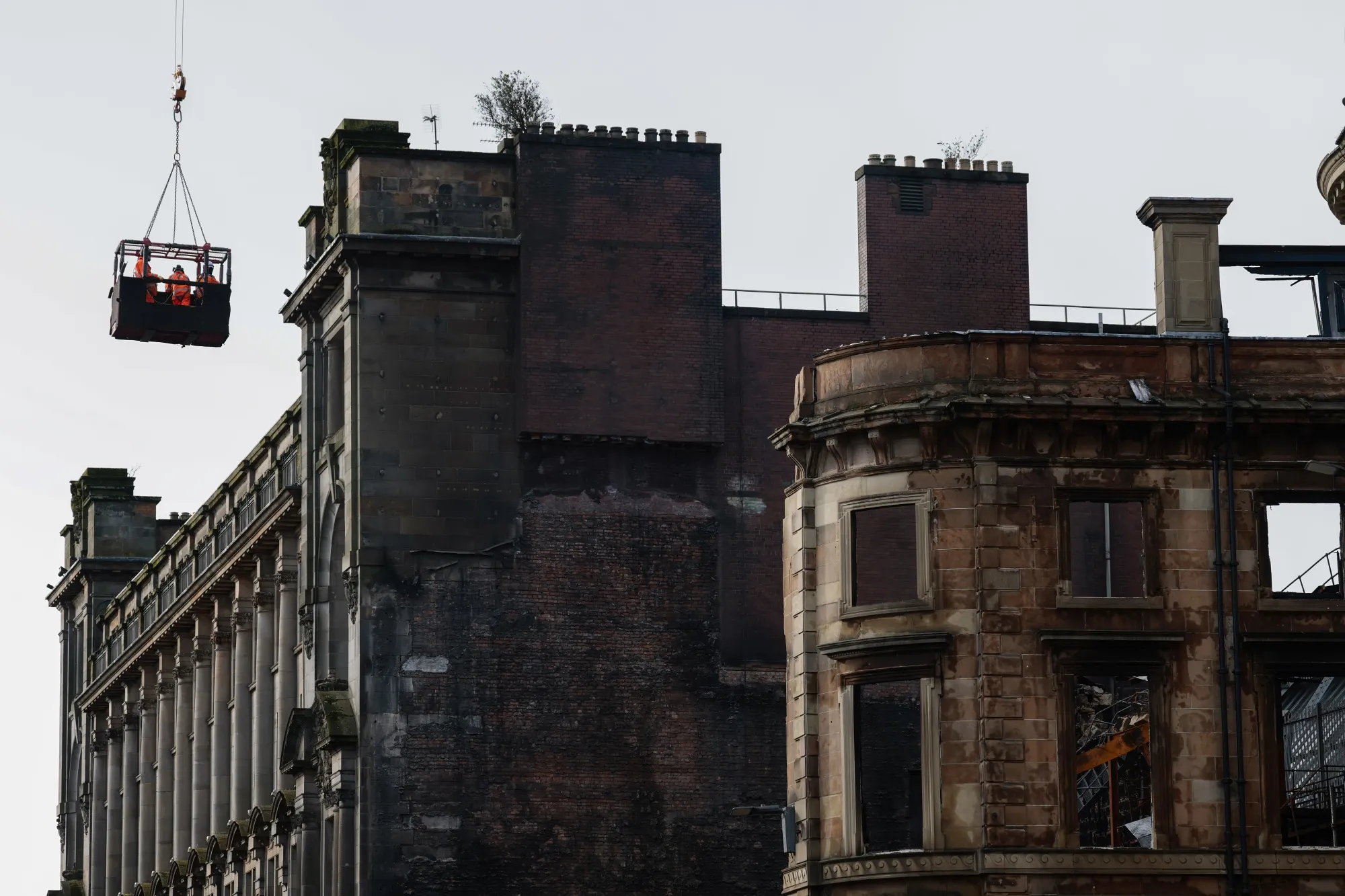 Demolition work begins on the fire-damaged building at Central Station in Glasgow on March 13, following a blaze a week earlier that consumed several buildings and disrupted travel through Glasgow’s main station.