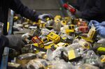 Workers sort batteries at Li-Cycle facility in Kingston, Ontario