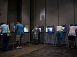 Voters fill out ballots at a polling station in Janesville, Wisconsin.
