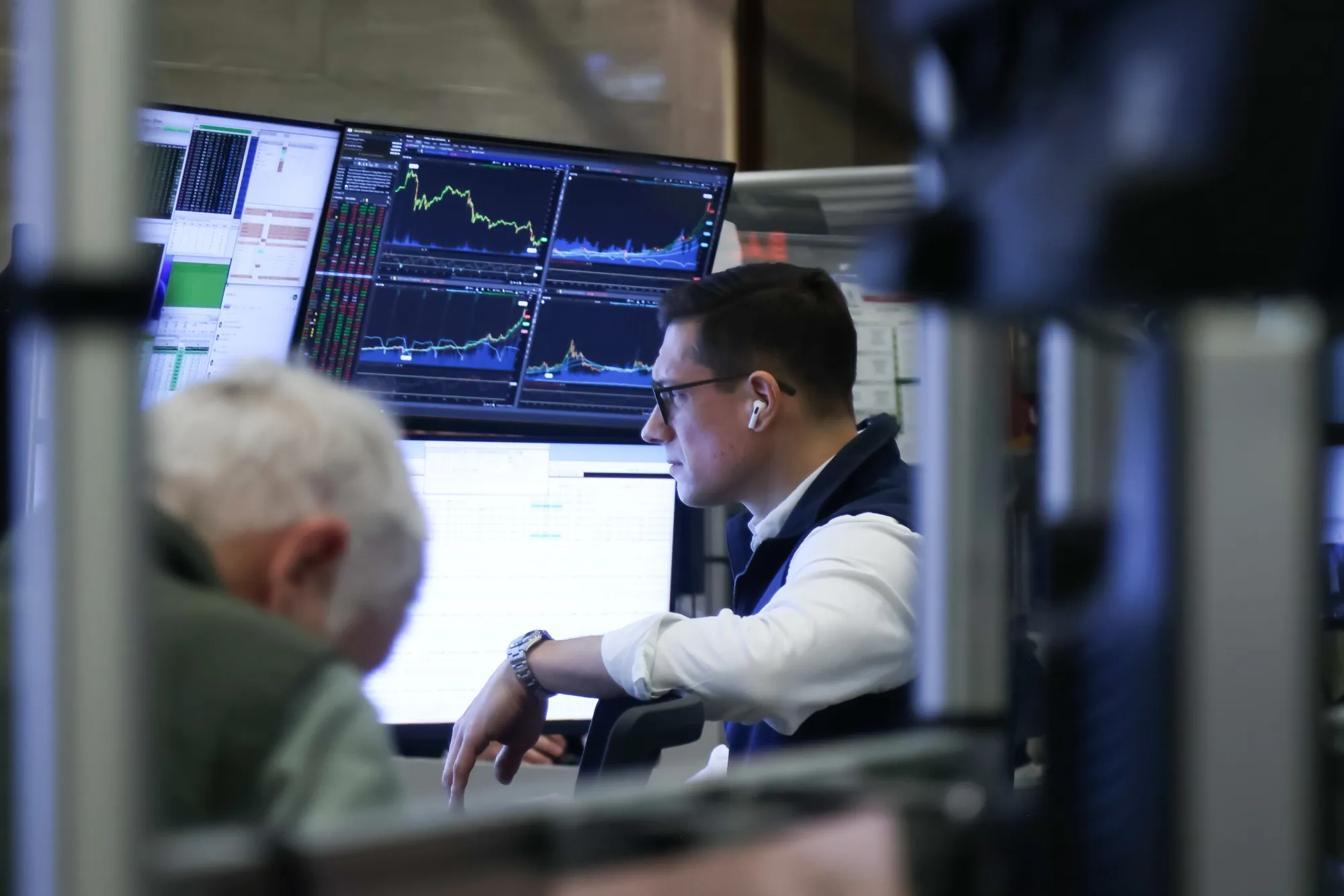Traders work on the floor of the American Stock Exchange (AMEX) at the New York Stock Exchange (NYSE) in New York.