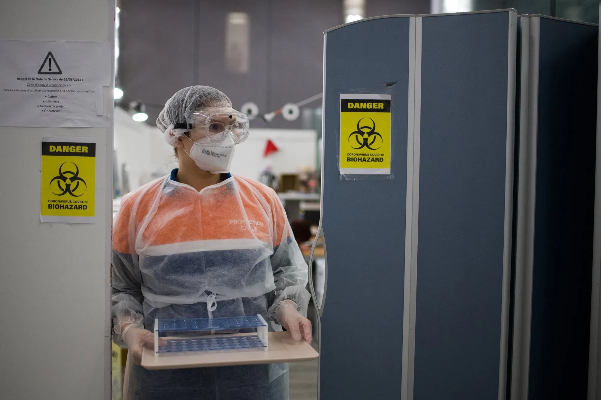 A lab technician conducts Covid-19 testing at Paris-Charles de Gaulle airport&nbsp;on&nbsp;Dec. 14.