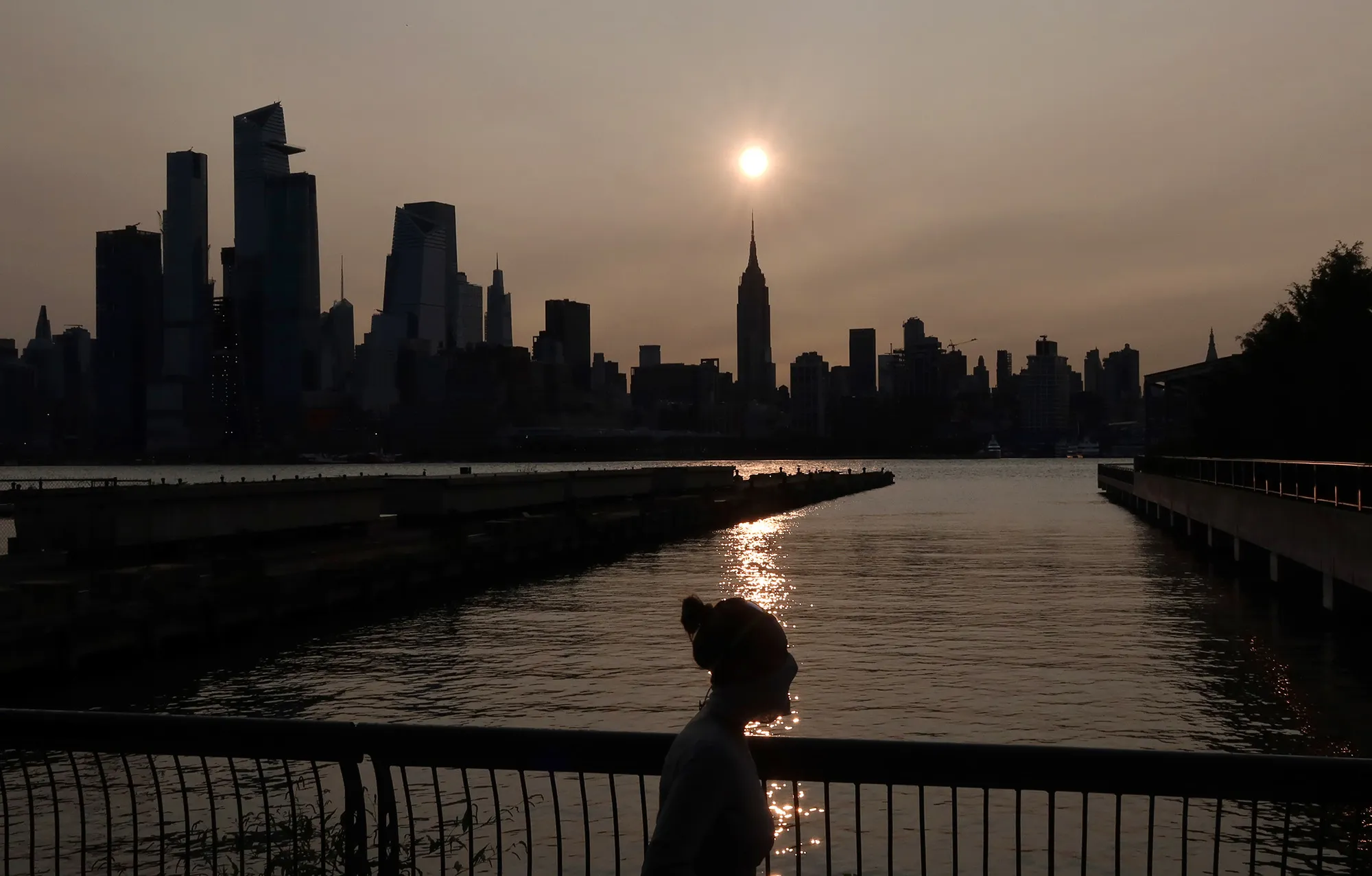 The sun rises behind the Empire State Building in New York City on Sept. 15.