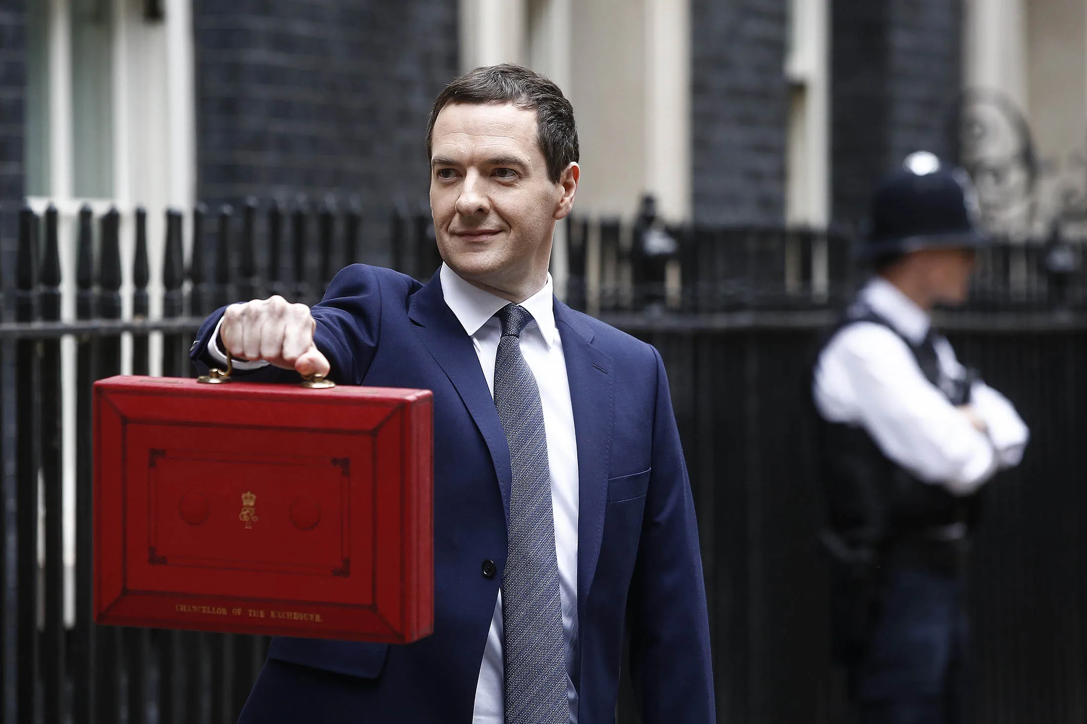 George Osborne, U.K. chancellor of the exchequer, holds the dispatch box containing the budget.
