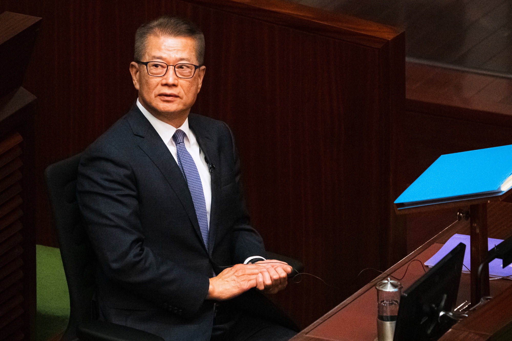 Paul Chan, Hong Kong's financial secretary, prepares to deliver his budget speech at the Legislative Council in Hong Kong, China, on Wednesday, Feb. 25, 2026. Chan has forecast the economy to grow 2.5% to 3.5% in 2026, signaling confidence in the city’s momentum after it staged a powerful comeback last year.