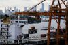 A container is unloaded from a ship docked at the Port of Bangkok in Bangkok, Thailand, on Wednesday, Sept. 23, 2015. The Bank of Thailand is scheduled to release its quarterly gross domestic product (GDP) on Sept. 25.