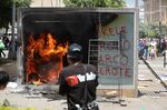 A Chivo Wallet Bitcoin ATM burns during a protest against President Nayib Bukele's policies on Independence Day in San Salvador, on September 15, 2021.