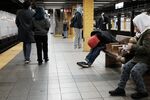 A man sleeps on a subway platform in New York on Jan. 19, 2022.